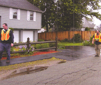 District employees work on leak detection.